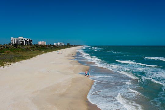 people-on-white-sand-beach People walking on white sand beach.